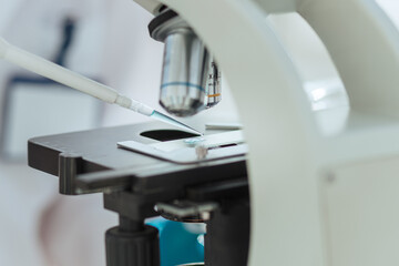 close up. scientist using automatic pipette for research .