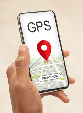 Modern gps application. African american man using smartphone with location tracking app