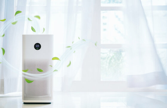 air purifier a living room,  air cleaner removing fine dust in house. protect PM 2.5 dust and air pollution concept