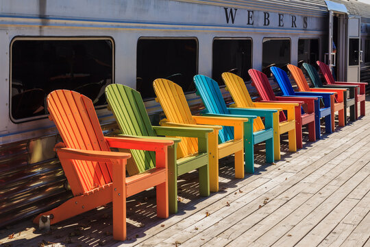 Orillia, On, Canada -September 26, 2015: Colorful Chairs In Front Of Dining Cars On The Patio Of Webers Restaurant Webers Is A Famous Hamburger Restaurant On On Highway 11 Near Orillia, Ontario. 