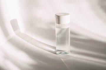 Flat lay with cleansing tonic in jar. Beauty background with facial cosmetic products. Spa concept. Beauty blogger, salon treatments concept. Minimalism.