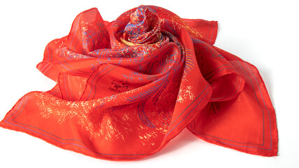 Bright red silk scarf beautifully folded on the white background. Natural light soft smooth fabric. 