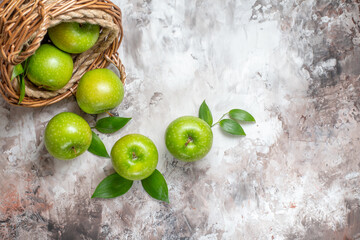 top view sliced green apples inside basket on light background mellow fresh photo color