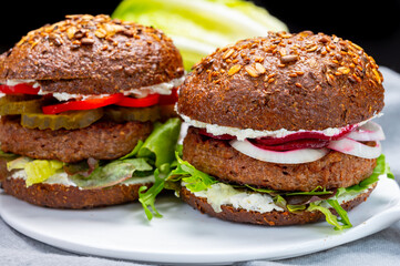 Grilled plant based, meat free vega burgers close up