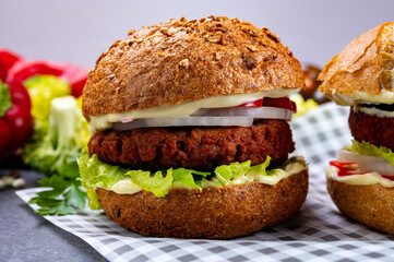 Tasty hamburger made with vegetarian plant based imitation minced meat burger and fresh vegetables