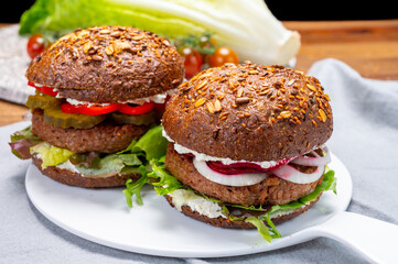 Grilled plant based, meat free vega burgers close up