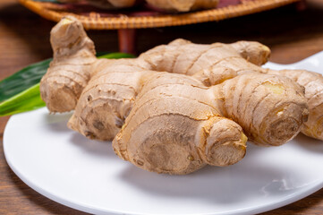Fresh ginger rhizome root used in traditional medicines and for flavoring meals worldwide.