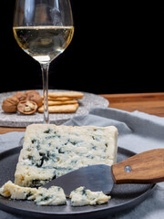 Cheese and wine pairing, french soft blue roquefort cheese and sweet white sauternes wine from Bordeaux, France