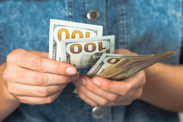 Dollars in hand, small salary. Winning the lottery.