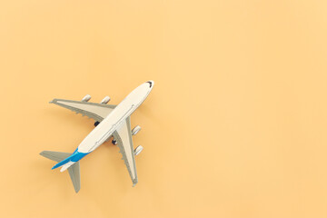 top view photo of airplane over pastel yellow background