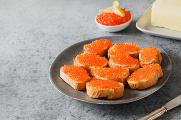 Canape with red caviar, tasty appetizer.