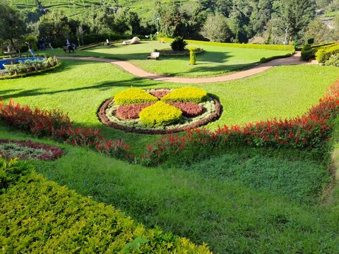 beautiful view of park garden with green land grass hill mountain blue sky background
