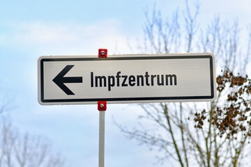 Road sign pointing towards German vaccination center called 'Impfzentrum' set up to vaccine people against Corona virus in Heidelberg