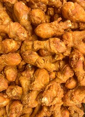 Golden brown Fried chicken background. Group of Spicy Fried chicken  in street food.