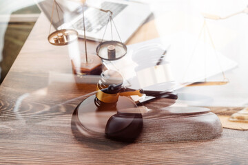 Business and lawyers discussing contract papers with brass scale on desk in office. Law, legal services, advice, justice and law concept picture with film grain effect