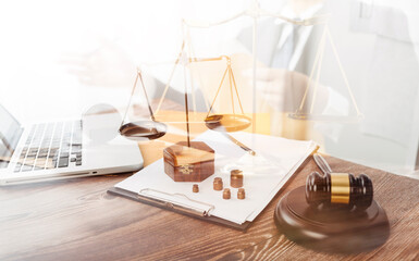 Business and lawyers discussing contract papers with brass scale on desk in office. Law, legal services, advice, justice and law concept
