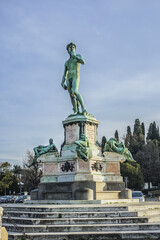 Fototapeta na wymiar Bronze replica of statue David in the center of Michelangelo Square (Piazzale Michelangelo, 1869) in Florence (Firenze). Italy.