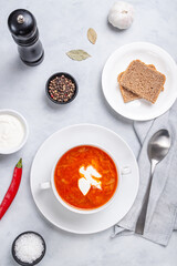 Traditional ukrainian russian soup (borscht) with bread and sour cream