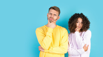 Mixed race friends standing on blue background