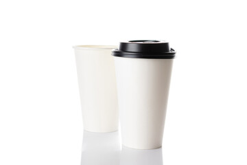 White paper cup for hot coffee with black lid isolated on white background. Takeaway blank small tea cup for your design text or banner of brand.