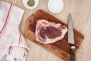 Raw and seasoned angus steak ready for the barbecue. Concept meat, food, organic.