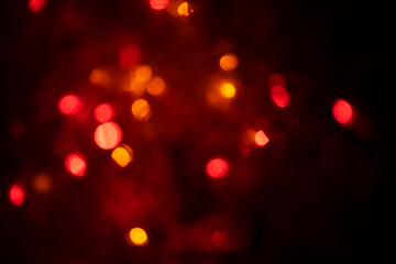 The red tone of the rare lights blurs the bokeh light. The background is out of focus. Background. copy space