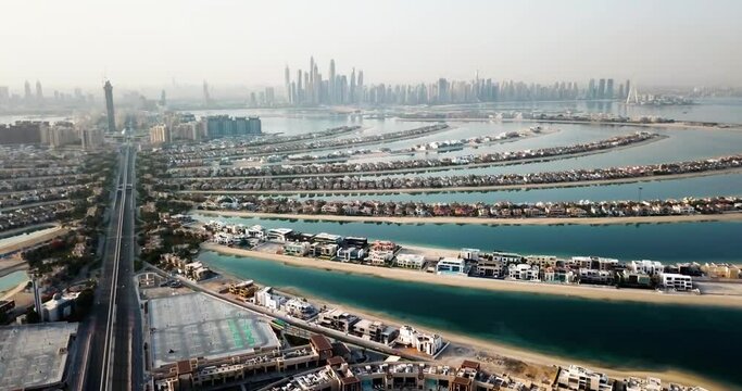 The Palm island with luxury villas and hotels in Dubai aerial view