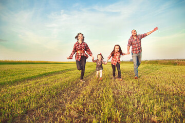 family running together in the field
