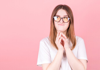 Portrait of young woman thinking and looks to copyspace