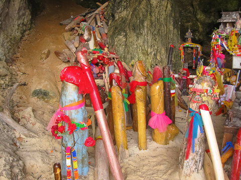 Carved wooden phalluses in Princess cave, Railay, Thailand.