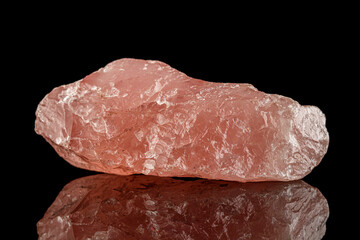 macro stone mineral rose quartz on a black background