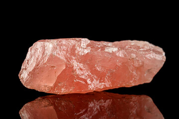 macro stone mineral rose quartz on a black background