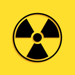 Black Radioactive icon isolated on yellow background. Radioactive toxic symbol. Radiation Hazard sign. Long shadow style. Vector.