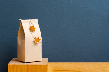 Selfmade gift box out of old beverage carton decorated with star shaped cut out dried roange peel...