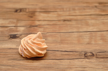 An orange meringue on a table