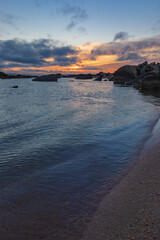 Sunrise on the sea coast with rocks