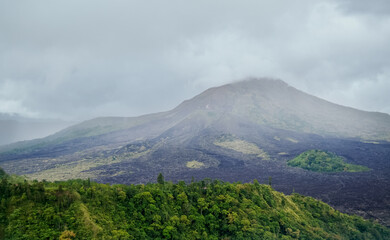Fototapeta na wymiar Gunung Batur is active volcano in the tropical island of Bali. The height of the volcano is 1717 meters