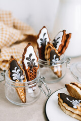 Sweet cookies in ice cream shape in glass jar on a table.