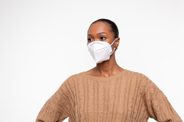 African-American woman in superhero pose wearing KN95 mask to keep her protect from viruses 0366