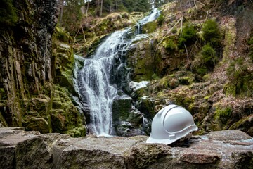 Green safety helmet in the mountains waterfall - Wodospad Kamieńczyka Szklarska Poręba
