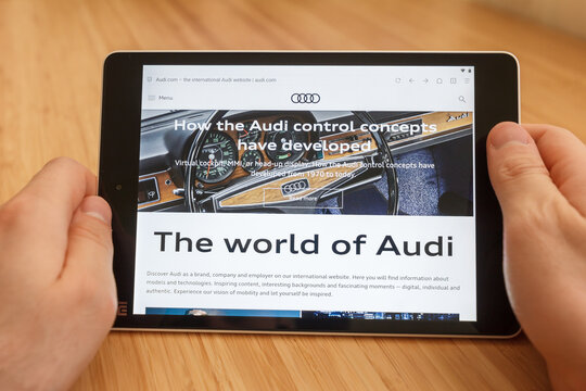 SAN FRANCISCO, US - 1 April 2019: Close up to hands holding tablet using internet and looking through Audi web site, in San Francisco, California, USA. An illustrative editorial image.
