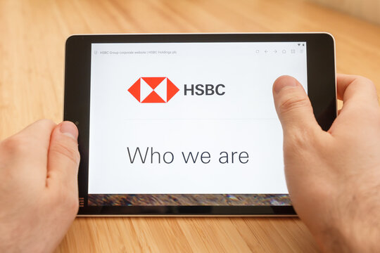 SAN FRANCISCO, US - 1 April 2019: Close up to hands holding tablet using internet and looking through HSBC web site, in San Francisco, California, USA. An illustrative editorial image.