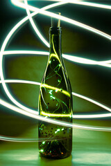 Bottle Lights with Cork, garland in glass bottle for wine. Selective focus, vertical view.