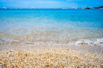 Beautiful summer seascape with ships, clear azure water and sandy beach in sunny day. French riviera