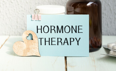 Hormone therapy -Diagnosis written on a white piece of paper. Treatment and prevention of disease. Syringe and vaccine with drugs. Medical and Healthcare concept. Selective focus