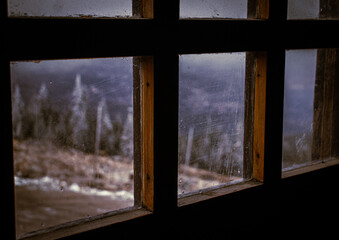 View on mountains from very old window