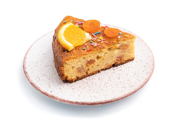 Piece of orange cake isolated on a white background. Side view.