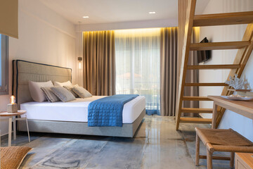 Modern nautical style interior of hotel apartment white bedroom with pine wood ladder, handmade...