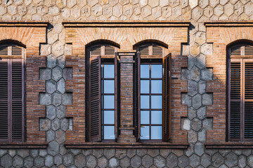 Windows with shutters of an old restored industrial factory
