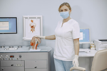 Doctor white medical coat. Woman ready to give consultancy. Doctor in a medical mask.